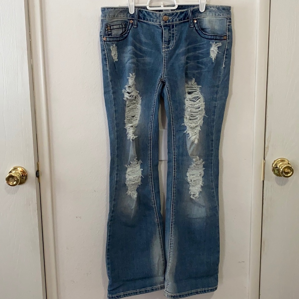 FLARE LEG RIPPED JEANS